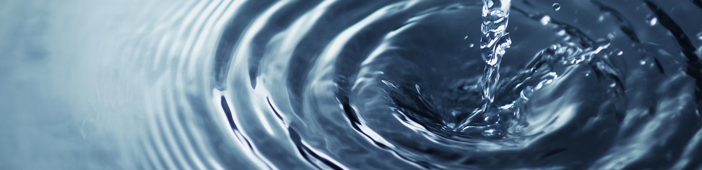 An image of a pool of blue rippling water.